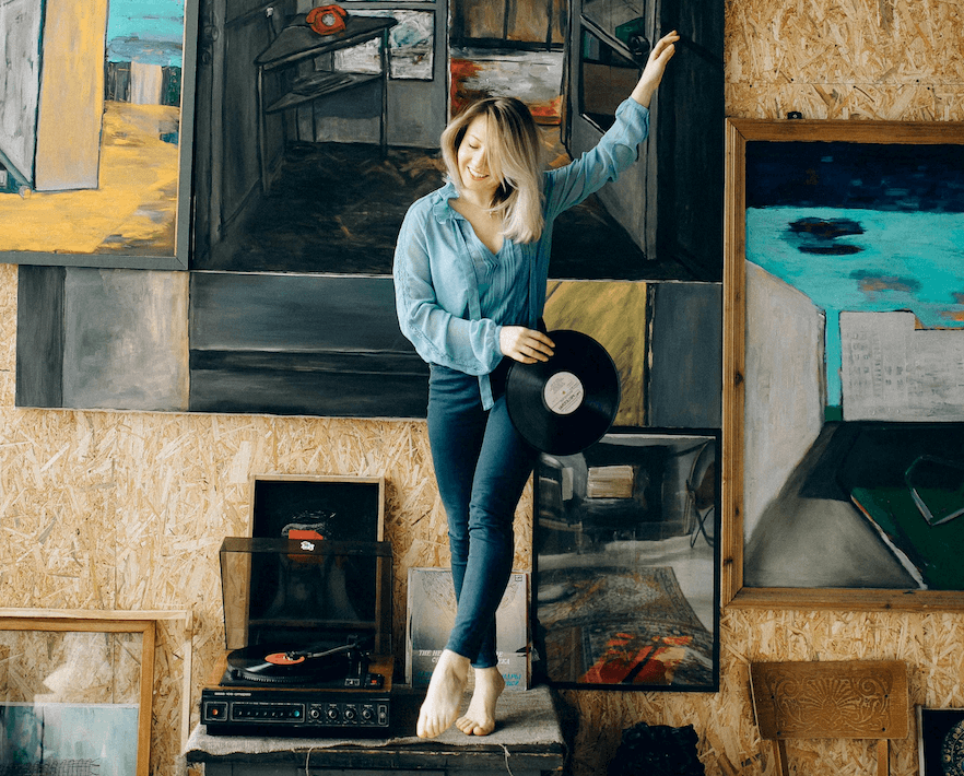 A girl holding a custom record